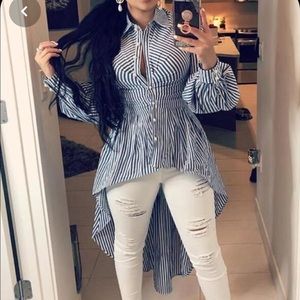 A blue and white striped shirt with a long tail